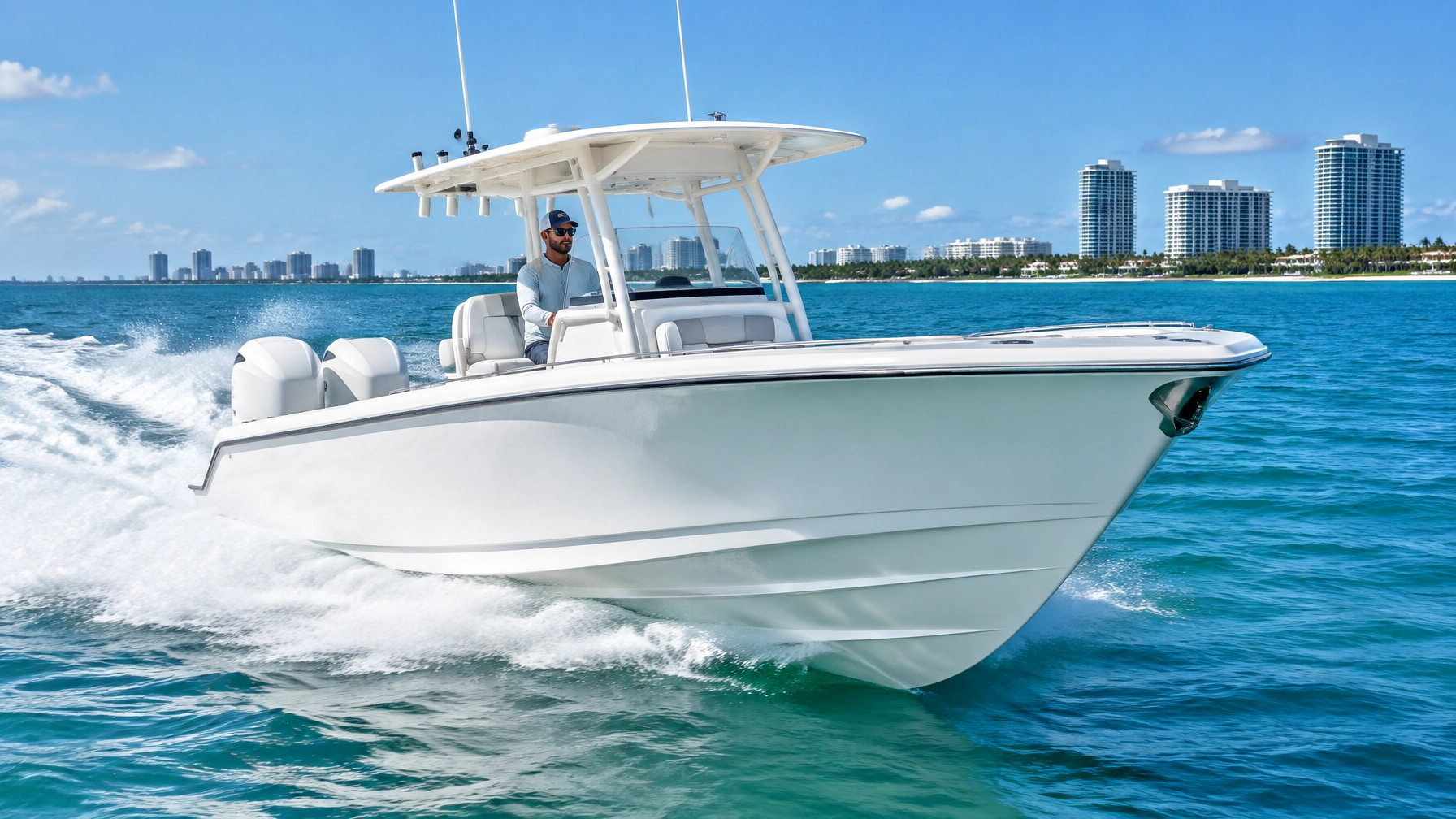 Wellcraft-style offshore center-console powerboat underway in South Florida coastal water
