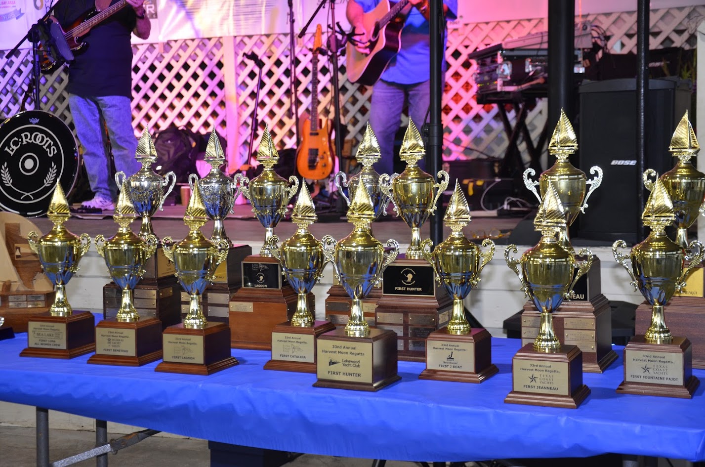 Trophies lined up on a table at the Harvest Moon Regatta awards party